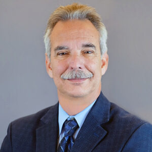 Marc Roberts Headshot - man in business suit